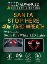 LED outdoor decoration that reads "Santa Stop Here." The text is red. It also features two Santa hats.