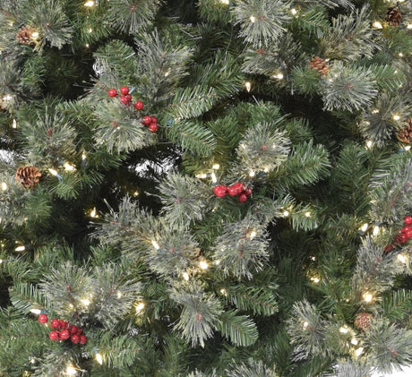 Artificial tree pre-lit with dual lights. Lights change from clear to multi-colored. The tree is decorated with red berries and white glitter.
