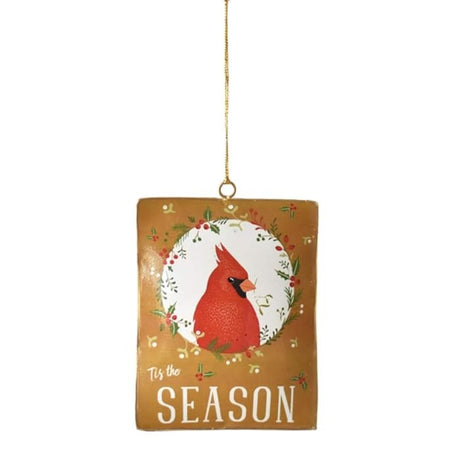 Decorative holiday ornament. This one is gold and features a cardinal surrounded by holly leaves and berries and reads "Tis the Season."