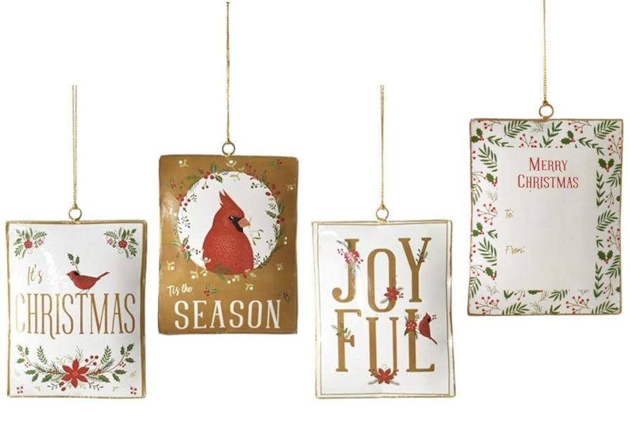 One is white and features a cardinal, some poinsettias and some holly leaves and reads "It's Christmas" and has a gold border. One is gold and features a cardinal surrounded by holly leaves and berries and reads "Tis the Season." One is white and reads "Joyful" with each letter featuring a small detail like a flower, a poinsettia, holly leaves and berries and a cardinal. One is white and reads "Merry Christmas" and it features a TO line and a FROM line with a border of holly leaves and berries.