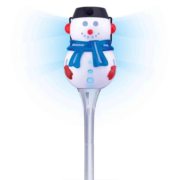 This image shows the snowman pathway light on a white background. The snowman has two eyes, a red nose, a smile, a blue scarf, red earmuffs and red gloves. The LED light inside is blue.