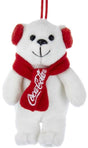 White teddy bear ornament with a red Coca-Cola scarf on a white background.