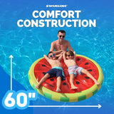 This is a lifestyle image showing two little boys resting on the pool float with their hands behind their backs while their dad holds the side of the float in the pool. It reads "Swimline. Comfort construction. Measures 60 inches long and wide."