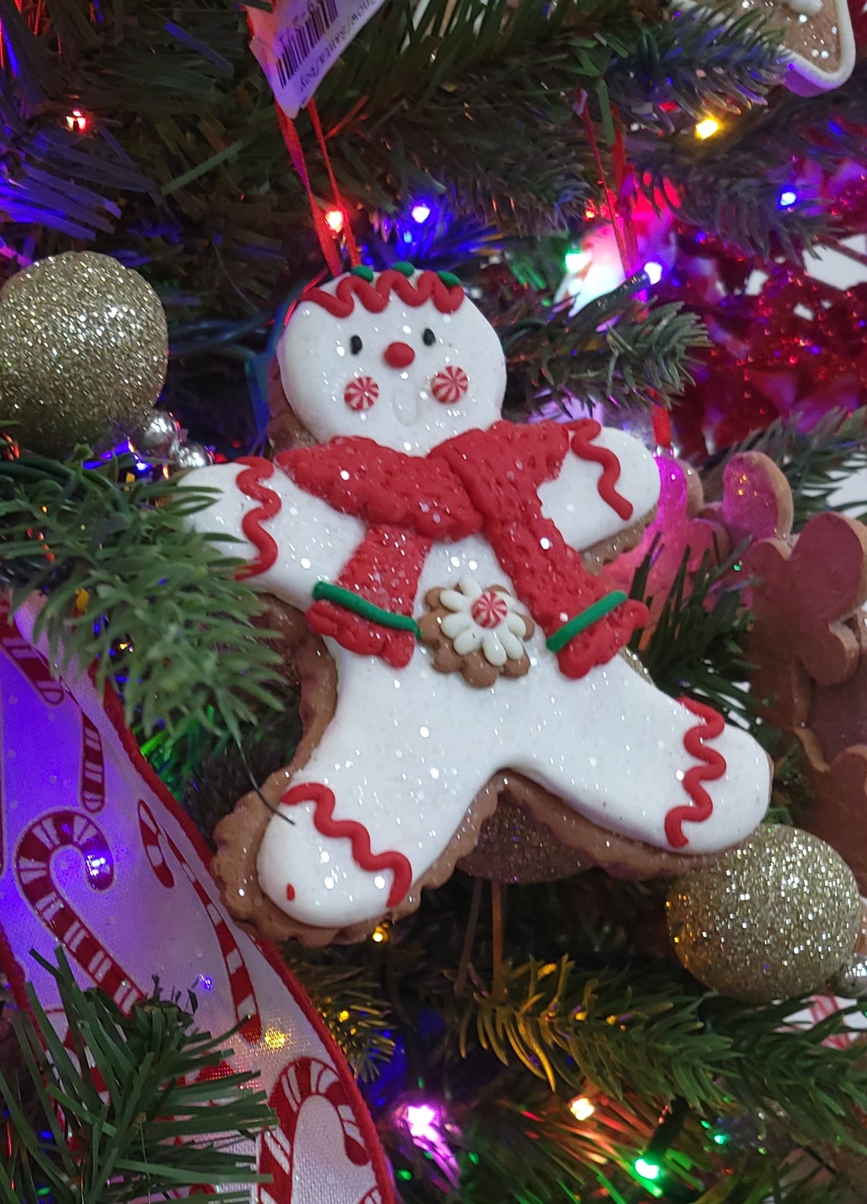 Ornaments shaped like decorated Christmas cookies.