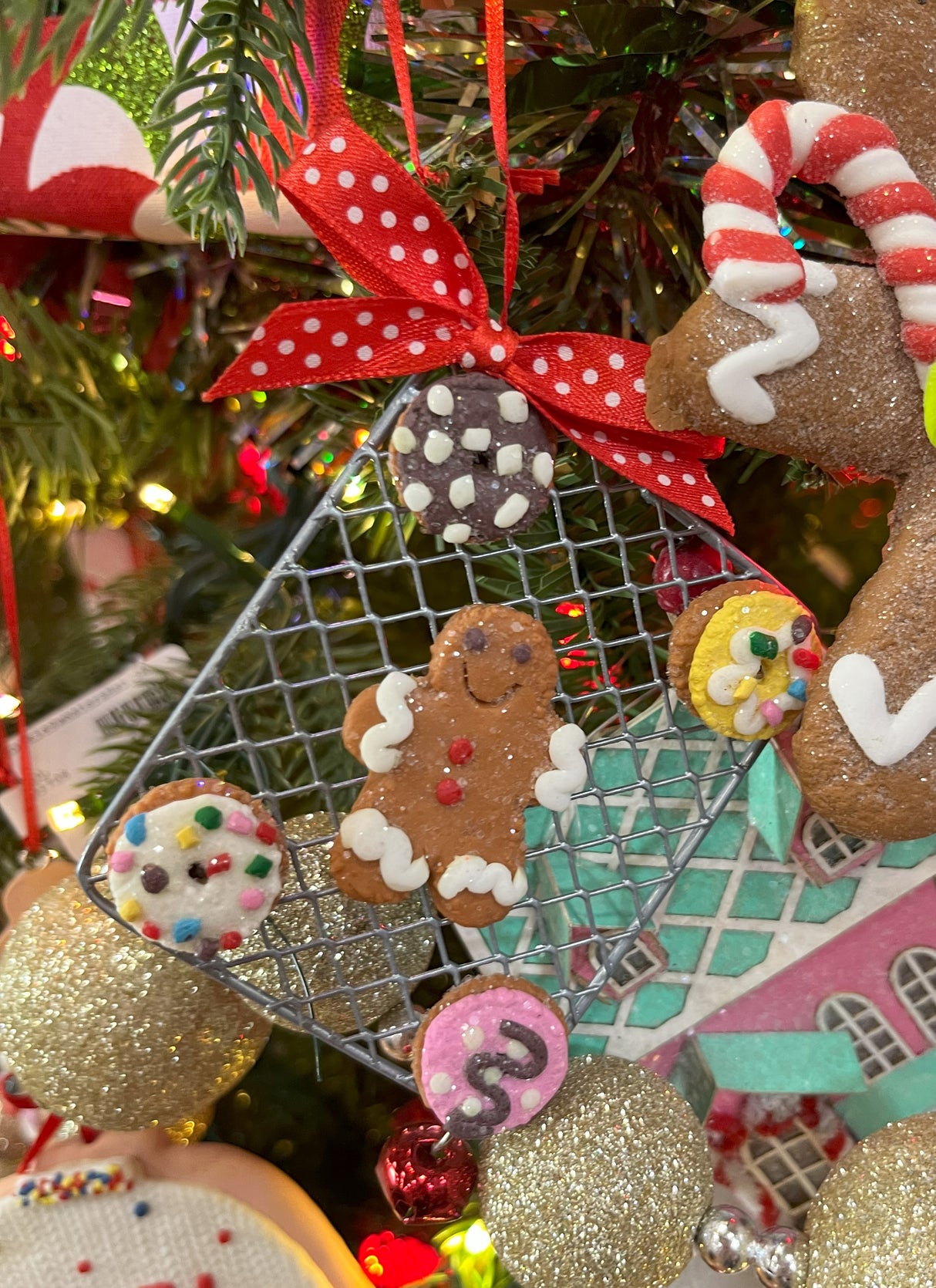Ornaments designed to look like cookies in silver cut outs or on trays.