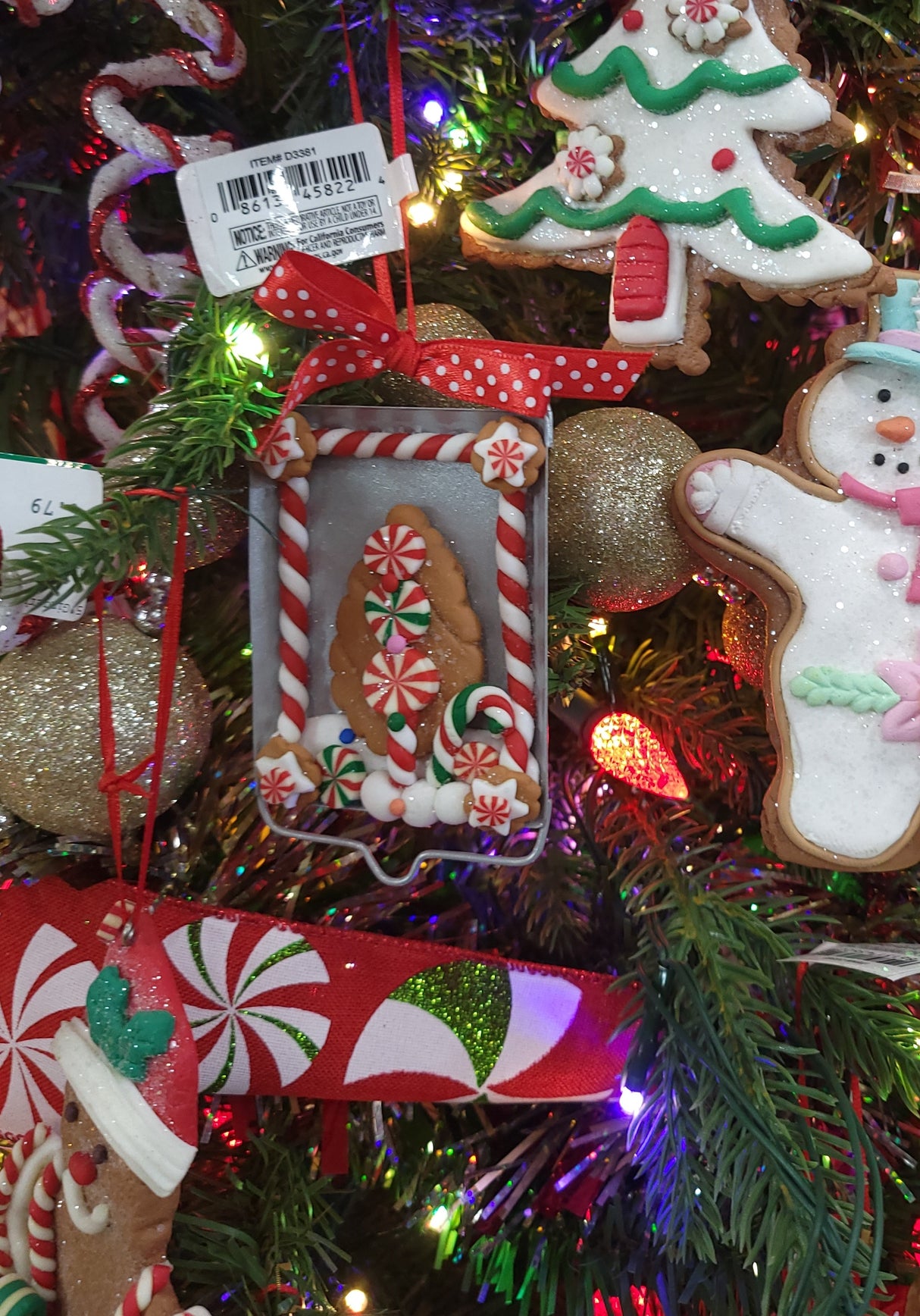 Ornaments designed to look like cookies in silver cut outs or on trays.