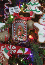 Ornaments designed to look like cookies in silver cut outs or on trays.