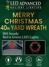Outdoor LED decoration that reads "Merry Christmas." The text is red. There are green holly leaves and red berries.