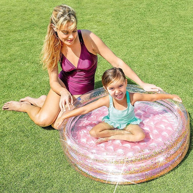 Pink and glittery mini inflatable kid's pool.