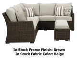 This image shows what the sectional sofa and the cushioned bench looks like on a white background. The image also reads "In Stock Frame Finish: Brown. In Stock Fabric Color: Beige."