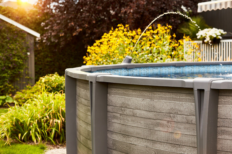 New Carvin above ground swimming pools. Swimming pool displays fountain option add on.