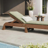 This is the same image as the one before except this chaise lounge chair has a light green colored seat cushion on it.