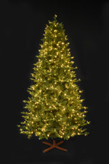 This image shows the tree pre-lit with Warm White Starry Lights. It has a wooden tree stand. This shows the tree on a black background.