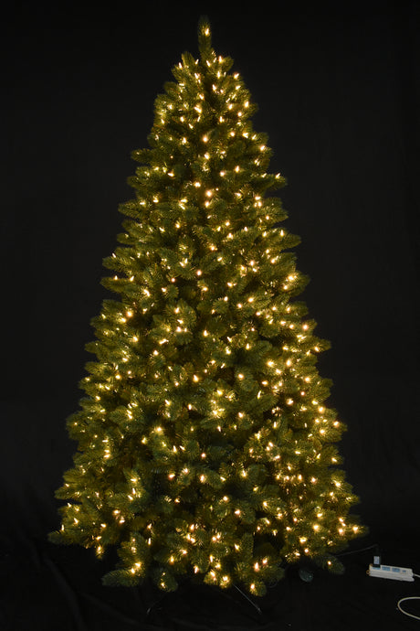 Artificial tree pre-lit with warm white lights.