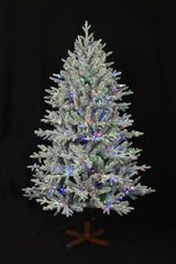 This image shows the flocked Christmas tree pre-lit with Multi-Colored Starry Lights. The tree is up against a black background.