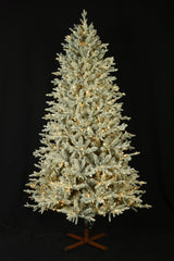 This image shows the flocked Christmas tree pre-lit with Warm White Starry Lights. The tree is up against a black background.