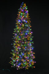 This image shows this specific artificial tree pre-lit with Multi-Colored Starry Lights. This tree is up against a black background.