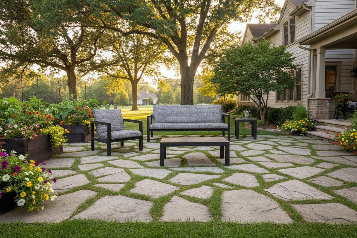 This is a lifestyle image showing the patio furniture set on a stone patio in a Midwestern backyard.