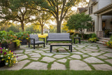 This is a lifestyle image showing the patio furniture set on a stone patio in a Midwestern backyard.