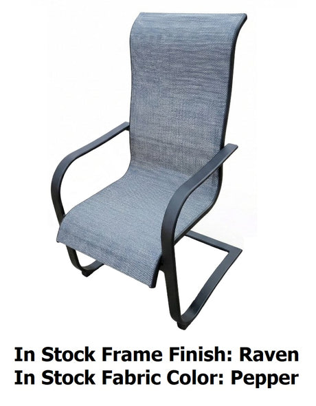This image shows what this spring dining chair looks like on a white background. The image reads "In Stock Frame Finish: Raven. In Stock Fabric Color: Pepper."