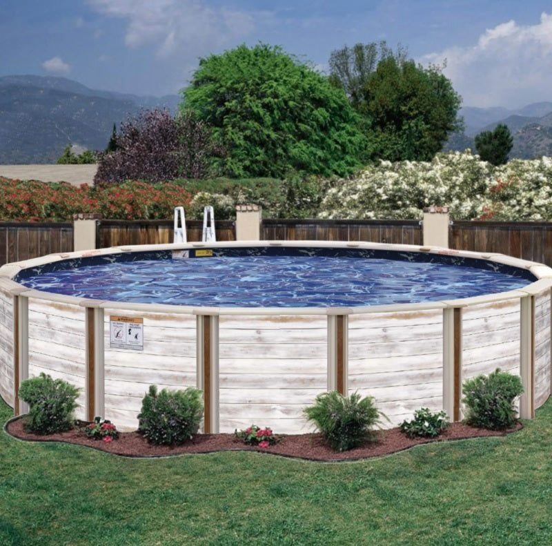 A white faux wooden semi-inground pool in a grassy backyard with a wooden fence behind it.