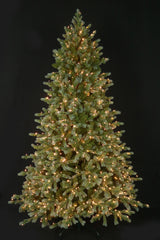 This is an image showing this artificial tree pre-lit with Warm White Starry Lights. This tree is up against a black background.