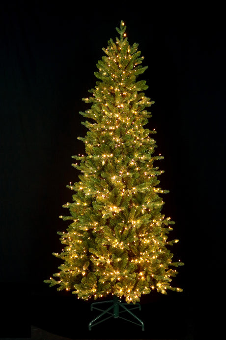 This image shows this specific tree with the Warm White Starry LED lights on on a black background.