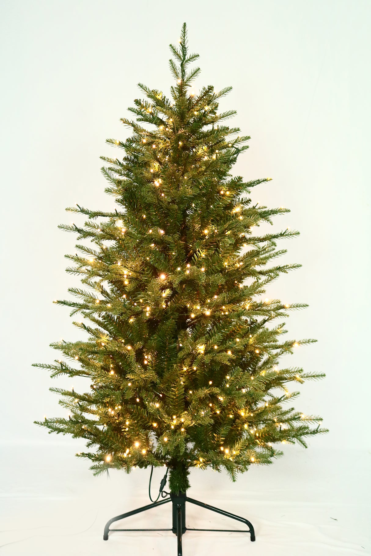 Artificial Christmas tree pre-lit with color-changing LED lights.