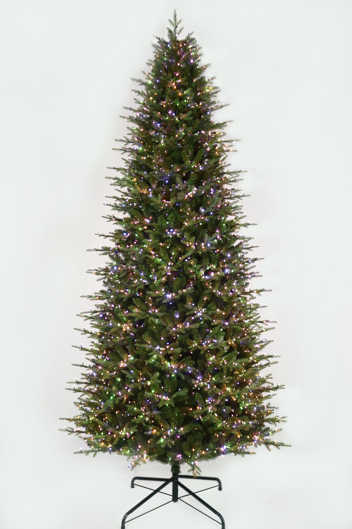 This 11 ft. artificial Christmas tree is pre-lit with Multi-Colored Starry Lights. This tree is up against a white background.