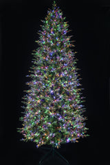 This 11 ft. artificial Christmas tree is pre-lit with Multi-Colored Starry Lights. This tree is up against a black background.
