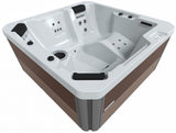 This image shows the Inspire hot tub on a white background.