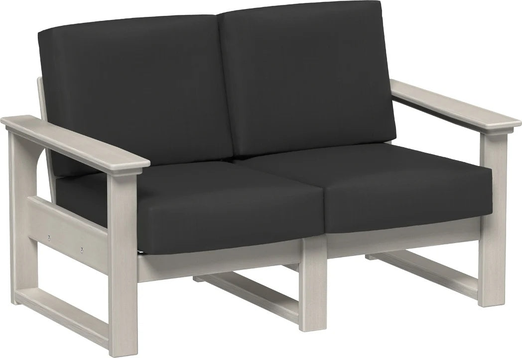 This image shows the deep seating loveseat on a white background. The frames are birch and the cushions are spectrum carbon.