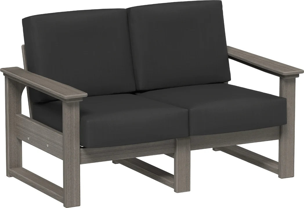 This image shows the deep seating loveseat on a white background. The frames are coastal gray and the cushions are spectrum carbon.