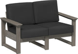 This image shows the deep seating loveseat on a white background. The frames are coastal gray and the cushions are spectrum carbon.