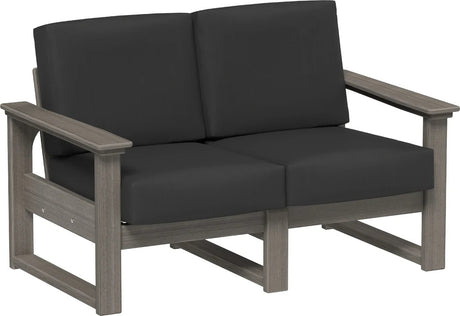 This image shows the deep seating loveseat on a white background. The frames are coastal gray and the cushions are spectrum carbon.