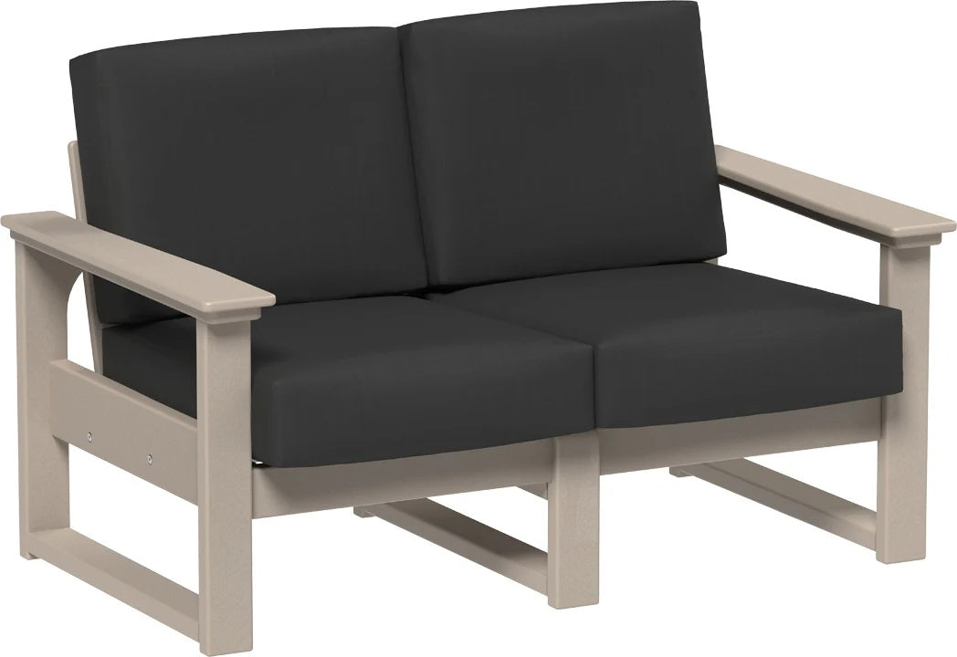 This image shows the deep seating loveseat on a white background. The frames are weatherwood and the cushions are spectrum carbon.