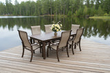 This image shows this patio dining set on a wooden dock next to a lake.