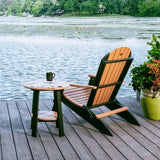 This is a lifestyle image showing the Cedar and Black colored Lakeside Adirondack Chair next to a matching table on a pier overlooking a body of water.