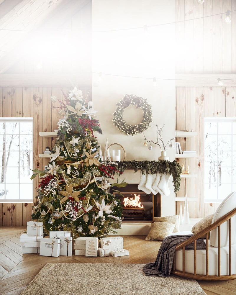 Decorated Christmas tree with presents in a living room with a fireplace and wreath.