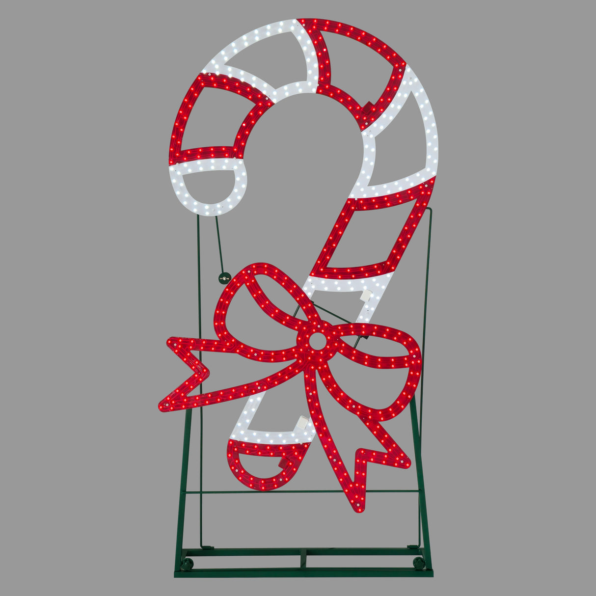 This image shows the candy cane decoration on a gray background. The candy cane is red and white striped and features a red bow on its base.