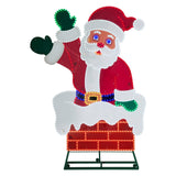 This image shows the LED Santa decoration on a white background. He's wearing the classic red and white Santa suit, green gloves and a blue belt with a gold buckle. He's popping out of a chimney made of red bricks and covered in snow.