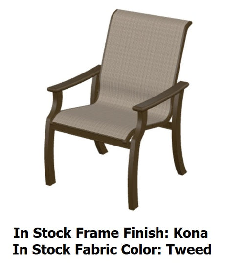 This image shows the dining chair on a white background. The image also reads "In Stock Frame Finish Color: Kona. In Stock Fabric Color: Tweed."