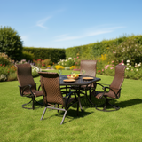 This is a lifestyle image showing this patio furniture set in a grassy yard on a sunny day.