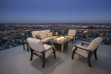This is a lifestyle image showing this patio furniture set on a terrace overlooking a city at nighttime.