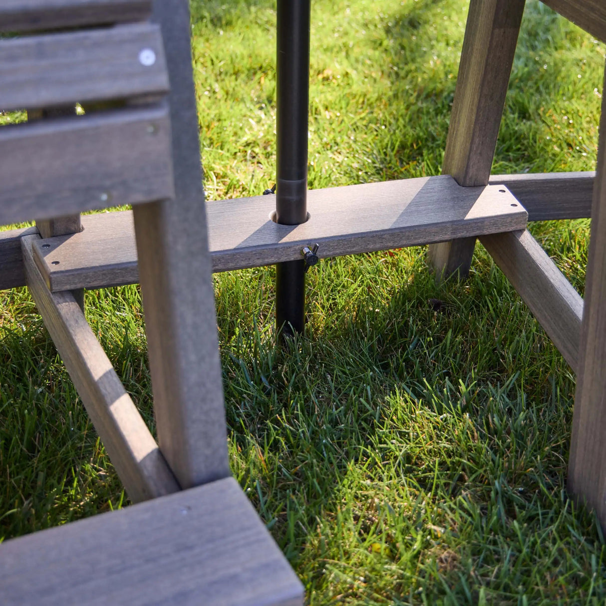 This is an up close view of the stabilizer for the umbrella to go through the tete-a-tete table.
