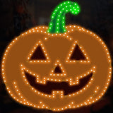 This image shows what this Halloween decoration looks like. It's an orange pumpkin with a green stem. The orange has been carved. It has two triangle eyes, a triangle nose and a smiling mouth.
