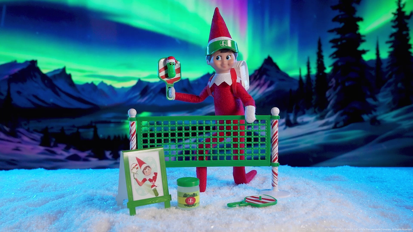 This video showcases the Elf on the Shelf pickleball set with the aurora borealis in the background.