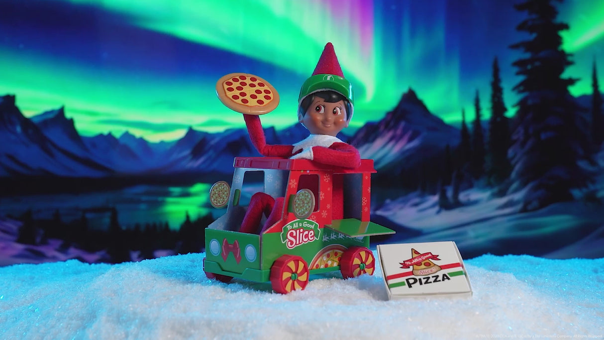 This video shows a Scout Elf sitting inside the pizza truck holding a pizza with the pizza box next to the truck.