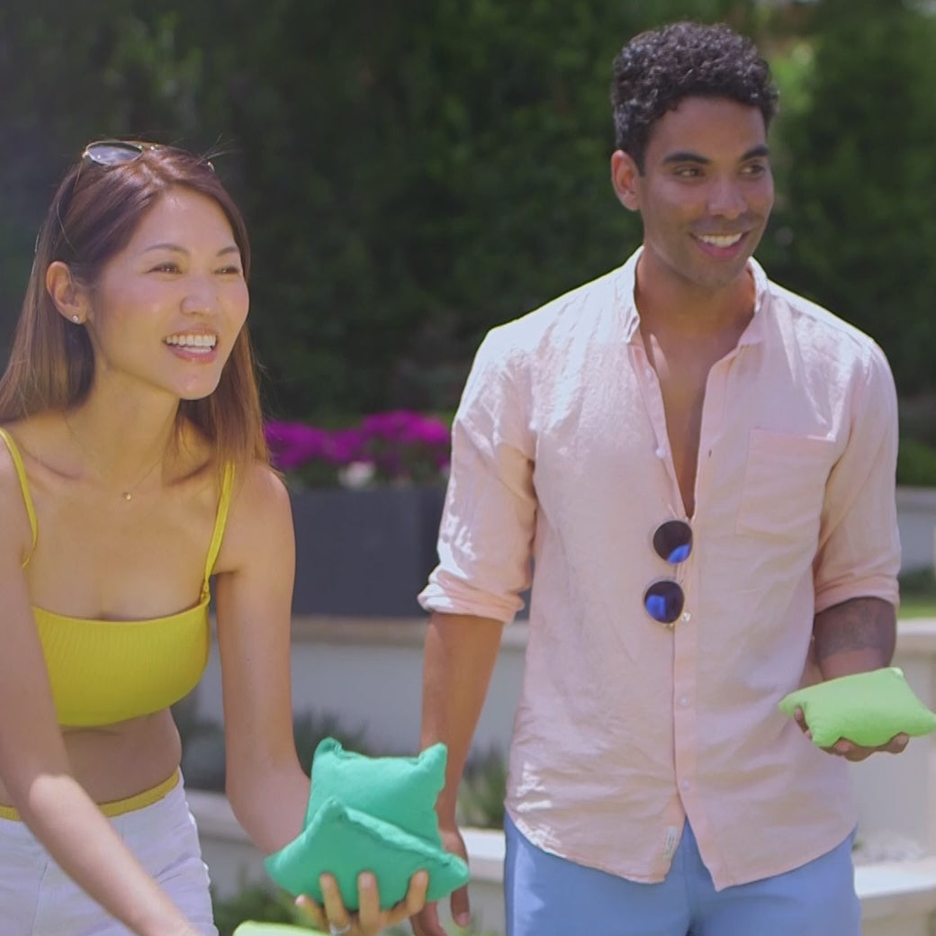 This is a video showing a bunch of people playing bags on the cornhole set from Ledge Lounger.