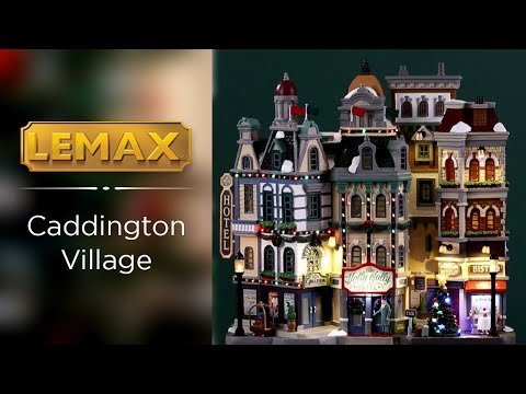 Resin lighted building for a Lemax display. Designed to look like a bunch of storefronts decorated for Christmas. There's a hotel, a cafe and a bistro.